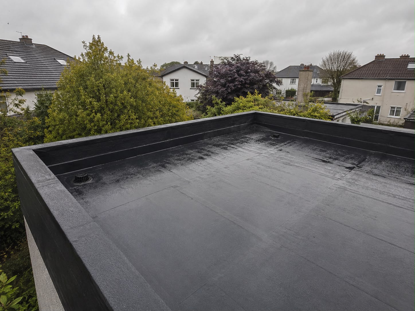 Flat roof parapet waterproofing detail on a Dublin project